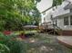 Spacious backyard features a deck, gazebo, and lush greenery, perfect for outdoor gatherings at 1005 Fairfax Woods Dr, Apex, NC 27502