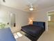 Comfortable bedroom with ceiling fan, mirror, and ensuite bathroom access at 1005 Fairfax Woods Dr, Apex, NC 27502