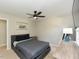 Inviting bedroom with neutral tones, complemented by a ceiling fan and bedside table at 1005 Fairfax Woods Dr, Apex, NC 27502