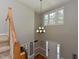 Grand foyer with high ceilings, chandelier, and hardwood floors at 1005 Fairfax Woods Dr, Apex, NC 27502
