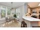 Bright kitchen featuring modern countertops, a breakfast bar, and plenty of natural light at 1005 Fairfax Woods Dr, Apex, NC 27502