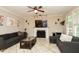 Cozy living room featuring a fireplace, TV, and comfortable seating at 1005 Fairfax Woods Dr, Apex, NC 27502