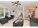 Spacious sunroom with a ceiling fan and access to the patio at 1005 Fairfax Woods Dr, Apex, NC 27502