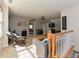 Upstairs living room featuring a sitting area, desk area, and access to an upstairs bedroom at 1005 Fairfax Woods Dr, Apex, NC 27502