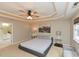 Bright and airy main bedroom, featuring a king-sized bed and cityscape art at 1005 Fairfax Woods Dr, Apex, NC 27502