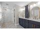 Bathroom with double sink vanity, gold hardware, stylish tile, and glass enclosed shower at 105 Jolyn Pl, Chapel Hill, NC 27517