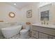 Elegant bathroom with freestanding tub, stylish wallpaper, and modern vanity at 105 Jolyn Pl, Chapel Hill, NC 27517