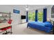 Bright bedroom with blue accents, natural light, desk, and ceiling fan at 105 Jolyn Pl, Chapel Hill, NC 27517