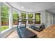 Bright exercise room with treadmills and views of the outdoor green space at 105 Jolyn Pl, Chapel Hill, NC 27517