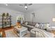 Inviting living room with a comfortable gray sectional sofa and stylish decor, open to kitchen at 105 Jolyn Pl, Chapel Hill, NC 27517