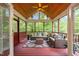 Relaxing screened porch with comfortable seating and beautiful views of the surrounding greenery at 105 Jolyn Pl, Chapel Hill, NC 27517