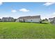 Spacious backyard with lush lawn, deck, and privacy fencing at 108 Hudson Dr, Princeton, NC 27569