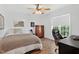 Comfortable bedroom with hardwood floors, wooden dresser, and modern office chair at 108 Hudson Dr, Princeton, NC 27569