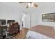 Bright bedroom with hardwood flooring, desk and chair, and ceiling fan at 108 Hudson Dr, Princeton, NC 27569
