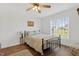 Bedroom with wood-look floors, natural light, and an inviting, neutral aesthetic at 108 Hudson Dr, Princeton, NC 27569