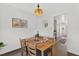 Cozy dining room with modern lighting and hardwood floors at 108 Hudson Dr, Princeton, NC 27569
