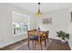 Cozy dining room with modern lighting, hardwood floors and natural light at 108 Hudson Dr, Princeton, NC 27569