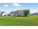 Exterior view showing a well kept lawn and simple landscaping at 108 Hudson Dr, Princeton, NC 27569