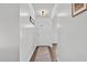 Bright entryway featuring a white front door, hardwood floors, and white walls at 108 Hudson Dr, Princeton, NC 27569