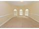 Bright room with carpet, natural light from windows, and a neutral wall color at 1126 Falling River Walk, Rocky Mount, NC 27804
