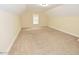 Spacious bedroom with neutral paint, carpet, and a window for natural light at 1126 Falling River Walk, Rocky Mount, NC 27804