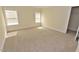 Comfortable bedroom with carpet, natural light from windows, and closet space at 1126 Falling River Walk, Rocky Mount, NC 27804