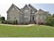 Charming two-story brick home featuring well-manicured landscaping and a welcoming entrance at 1126 Falling River Walk, Rocky Mount, NC 27804
