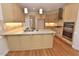 Eat-in kitchen island with granite countertops, stainless steel appliances and wood floors at 1126 Falling River Walk, Rocky Mount, NC 27804
