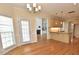 Eat-in kitchen with wood floors, stainless steel appliances and an adjoining dining room at 1126 Falling River Walk, Rocky Mount, NC 27804