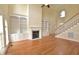 Elegant living room with hardwood floors, fireplace, and custom built-in shelving at 1126 Falling River Walk, Rocky Mount, NC 27804