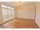 Open living room with wood floors and a chandelier at 1126 Falling River Walk, Rocky Mount, NC 27804