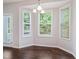 Dining area with large windows and door at 115 Snowy Orchid Ln, Smithfield, NC 27577