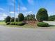View of the 'Tralee' neighborhood entrance sign and landscaping at 115 Snowy Orchid Ln, Smithfield, NC 27577