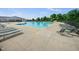 A community swimming pool with clear blue water and deck chairs at 115 Snowy Orchid Ln, Smithfield, NC 27577