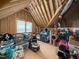 Unfinished attic space showcasing wooden beams and ample room for storage or future renovation projects at 1176 Sagamore Dr, Louisburg, NC 27549