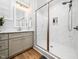 Bathroom shower offers marble tiling, glass doors and built-in shelving at 1176 Sagamore Dr, Louisburg, NC 27549