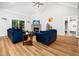 Inviting living room featuring a fireplace, vaulted ceilings, and lots of natural light at 1176 Sagamore Dr, Louisburg, NC 27549