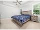 Large main bedroom is filled with natural light from the two large windows at 1176 Sagamore Dr, Louisburg, NC 27549