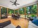Inviting screened porch with a dining set, a ceiling fan, and a relaxing lounge area for outdoor enjoyment at 1176 Sagamore Dr, Louisburg, NC 27549