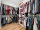 Spacious walk-in closet with built-in shelving and hanging rods for optimal storage at 1176 Sagamore Dr, Louisburg, NC 27549