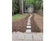 Backyard with a stepping stone path leading to a charming storage shed at 1205 Willow Dr, Chapel Hill, NC 27517