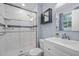 Modern bathroom featuring a glass-enclosed shower with white tiling, modern fixtures, and a vanity at 1205 Willow Dr, Chapel Hill, NC 27517