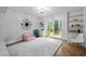 Versatile bonus room with built-in shelves, natural light, and space for activities at 1205 Willow Dr, Chapel Hill, NC 27517