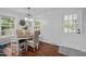 Bright dining room featuring a round table, wood floors, and lots of natural light from the surrounding windows at 1205 Willow Dr, Chapel Hill, NC 27517