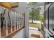 Warm and welcoming entryway with wood accents, views of the front yard and a stairway to the upper floor at 1205 Willow Dr, Chapel Hill, NC 27517