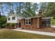 Attractive brick home with a well-maintained front yard, complimented by a screened in back porch at 1205 Willow Dr, Chapel Hill, NC 27517