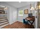 Bright home office with wood floors, stylish desk, and natural light from a window at 1205 Willow Dr, Chapel Hill, NC 27517