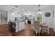 Bright kitchen showcases an island, stainless steel appliances, and an adjacent breakfast nook with natural light at 1205 Willow Dr, Chapel Hill, NC 27517