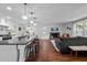 Open-concept living area combining kitchen and living room, ideal for modern living and entertaining at 1205 Willow Dr, Chapel Hill, NC 27517