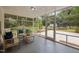 Inviting screened porch with comfortable seating, offering a serene outdoor living space with backyard views at 1205 Willow Dr, Chapel Hill, NC 27517